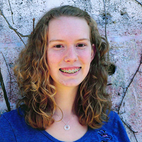 Real photo of Annika Greggs, animator at The Olive Book, highlighting her role in creating interactive content for SAT preparation.